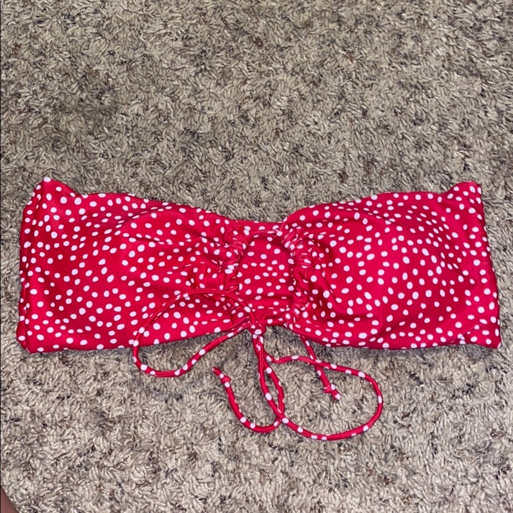 Red and white polka dotted swim top